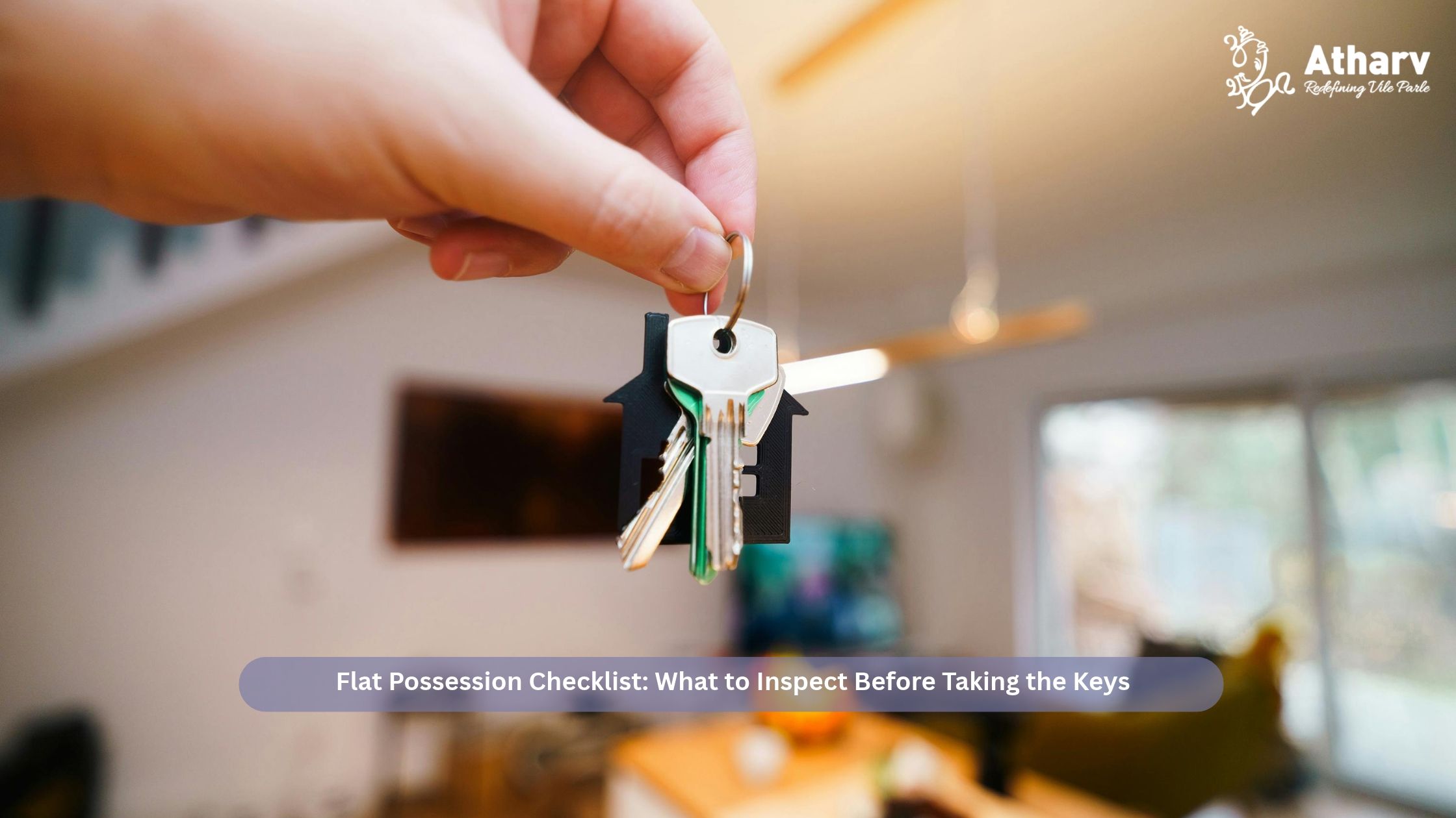 Hand holding the keys to a new apartment, illustrating the flat possession checklist to follow before taking the keys